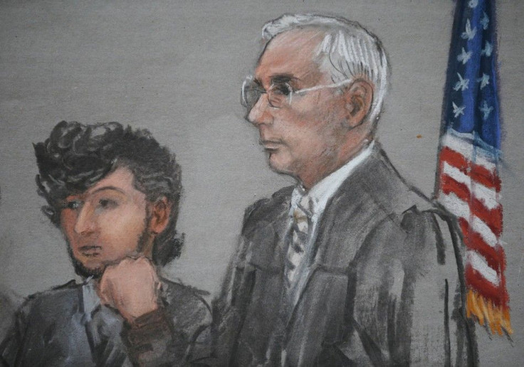 Accused Boston Marathon bomber Dzhokhar Tsarnaev is shown in a courtroom sketch next to Judge George O'Toole on the first day of jury selection at the federal courthouse in Boston