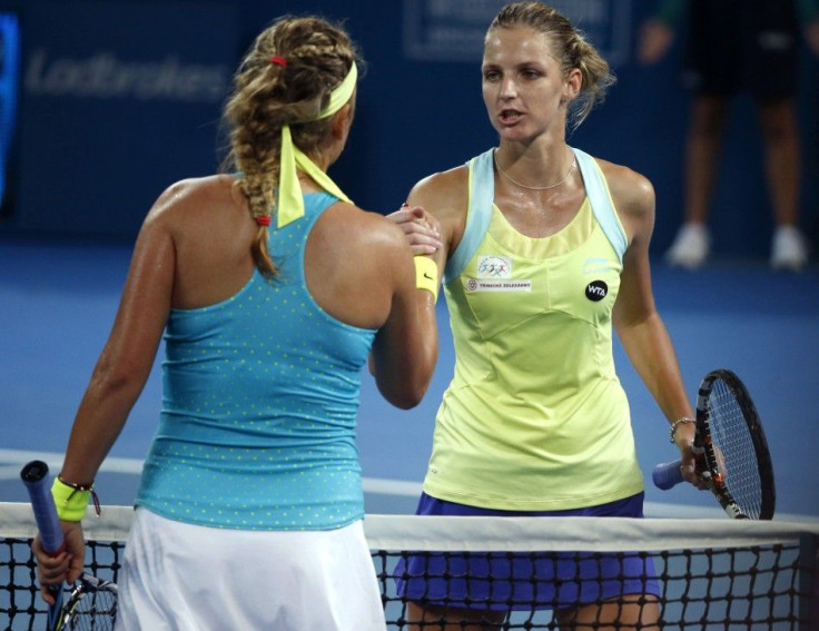 Karolina Pliskova of the Czech Republic (R) wins her women&#039;s singles first round match against Victoria Azarenka of Belarus at the Brisbane International tennis tournament in Brisbane January 5, 2015.