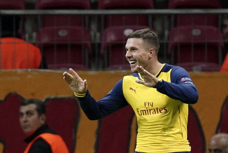 Arsenal's Lukas Podolski celebrates his second goal against Galatasaray during their Champions League Group D soccer match at Ali Sami Yen Spor Kompleksi in Istanbul December 9, 2014.