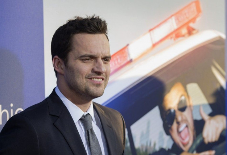 Cast member Jake Johnson poses at the premiere of "Let's Be Cops"