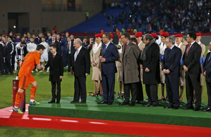 Real Madrid&#039;s captain Casillas (L) shakes hand with Morocco&#039;s Prince Moulay Hassan after their team won the Club World Cup final soccer match against San Lorenzo at Marrakesh stadium December 20, 2014. FIFA President Sepp Blatter looks on at 3rd