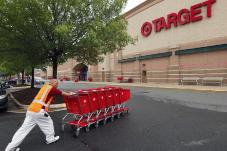 A Target employee returns carts to the store in Falls Church, Virginia May 14, 2012. Target Corp. (TGT) will report its first quarter results on May 16th.  REUTERS/Kevin Lamarque