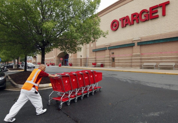 A Target employee returns carts to the store in Falls Church, Virginia May 14, 2012. Target Corp. (TGT) will report its first quarter results on May 16th.  REUTERS/Kevin Lamarque