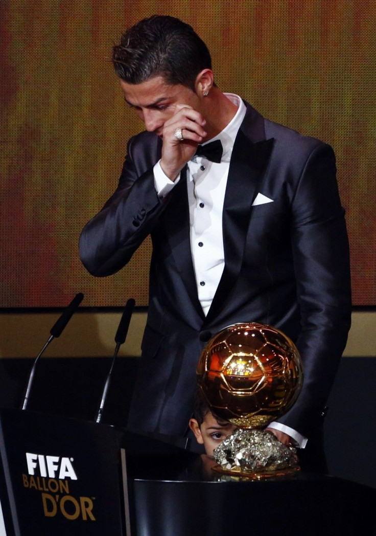 Portugal&#039;s Cristiano Ronaldo reacts with his son Cristiano Ronaldo Jr after being awarded the FIFA Ballon d&#039;Or 2013 in Zurich January 13, 2014. Portugal and Real Madrid forward Cristiano Ronaldo was named the world&#039;s best footballer for the
