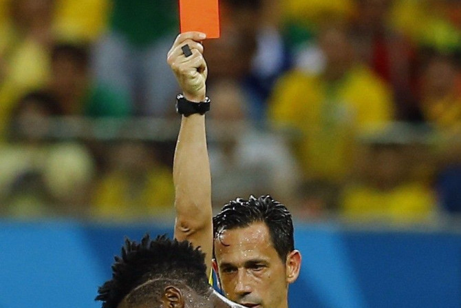 Referee Pedro Proenca of Portugal sends off Cameroon&#039;s Alexandre Song for a challenge on Croatia&#039;s Mario Mandzukic during their 2014 World Cup Group A soccer match at the Amazonia arena in Manaus June 18, 2014.