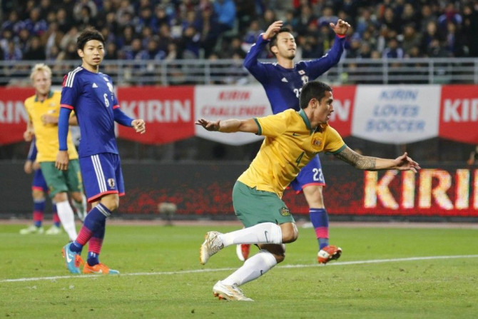 Tim Cahill (front R) of Australia celebrates after scoring against Japan during their international friendly soccer match in Osaka, western Japan November 18, 2014.