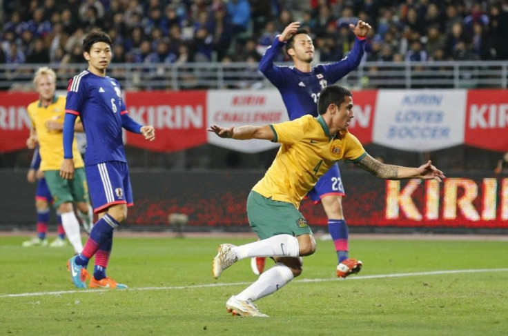 Tim Cahill (front R) of Australia celebrates after scoring against Japan during their international friendly soccer match in Osaka, western Japan November 18, 2014.