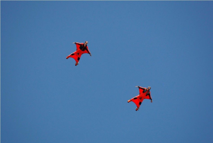 Skydivers fall towards America&#039;s Cup port before the Louis Vuitton Cup winners ceremony in Valencia