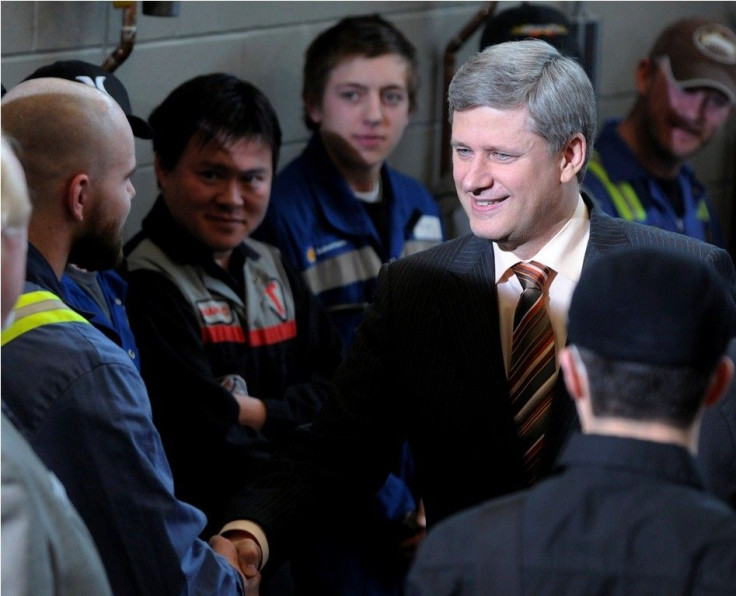 Canada's Prime Minister Stephen Harper shakes hands with NAIT apprentice students
