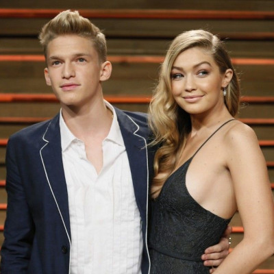 Musician Cody Simpson and his girlfriend Gigi Hadid arrive at the 2014 Vanity Fair Oscars Party