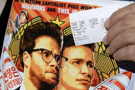 A Ticket And A Poster Of The Film 'The Interview' Starring Actors Seth Rogen And James Franco
