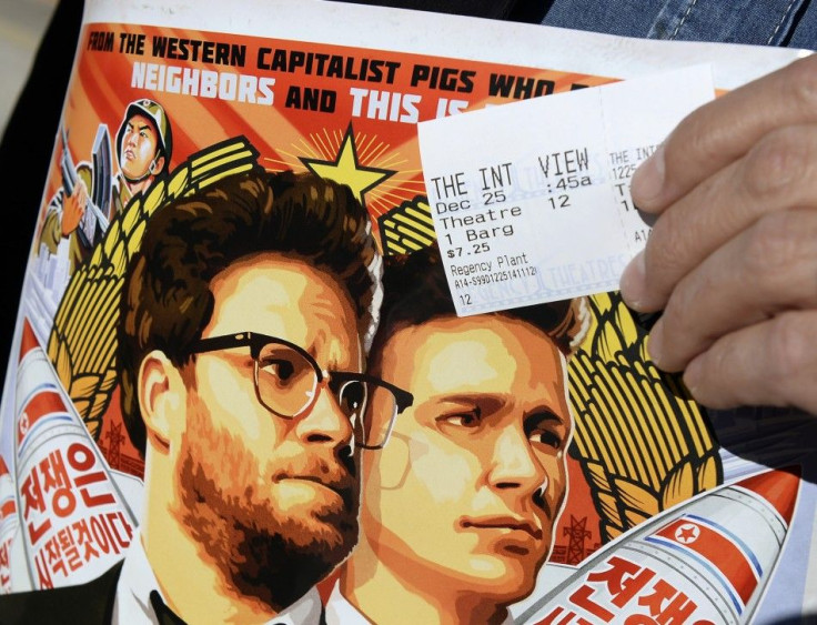 A Ticket And A Poster Of The Film 'The Interview' Starring Actors Seth Rogen And James Franco