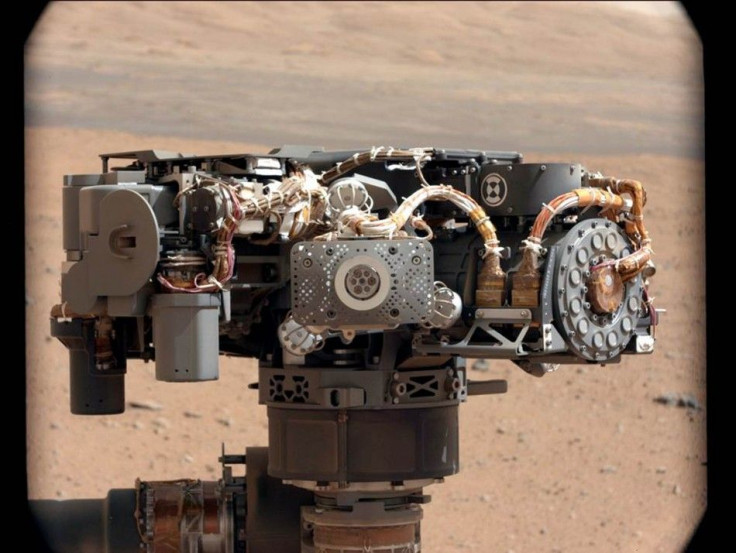In this image taken by Curiosity's Mast Camera, the Alpha Particle X-Ray Spectrometer (APXS) on NASA's Curiosity rover is pictured, with the Martian landscape in the background on the 32nd Martian day, or sol, of operations on the surface on Sep