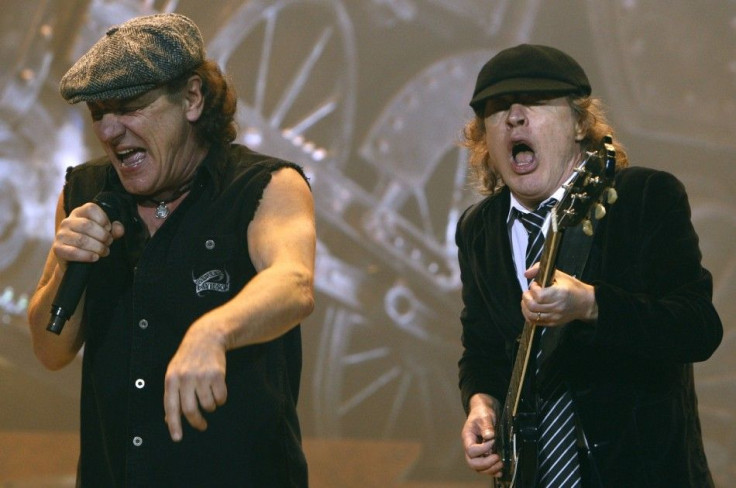 AC/DC lead vocalist Brian Johnson (L) and Angus Young performs at the O2 Millennium Dome stadium in London April 14, 2009.   REUTERS/Luke MacGregor