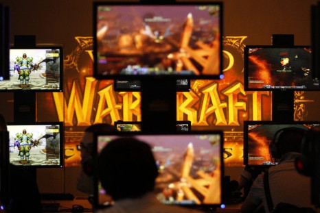 Visitors play ''World of Warcraft'' at an exhibition stand