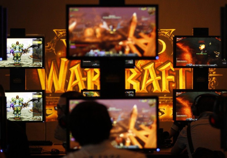 Visitors play ''World of Warcraft'' at an exhibition stand