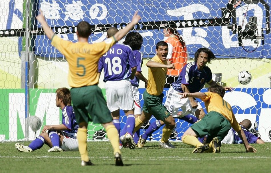 Australias John Aloisi 3rd R and Jason Culina 5 celebrates team mate Tim Cahills not in picture first goal against Japan during their Group F World Cup 2006 soccer match in Kaiserslautern June 12, 2006.