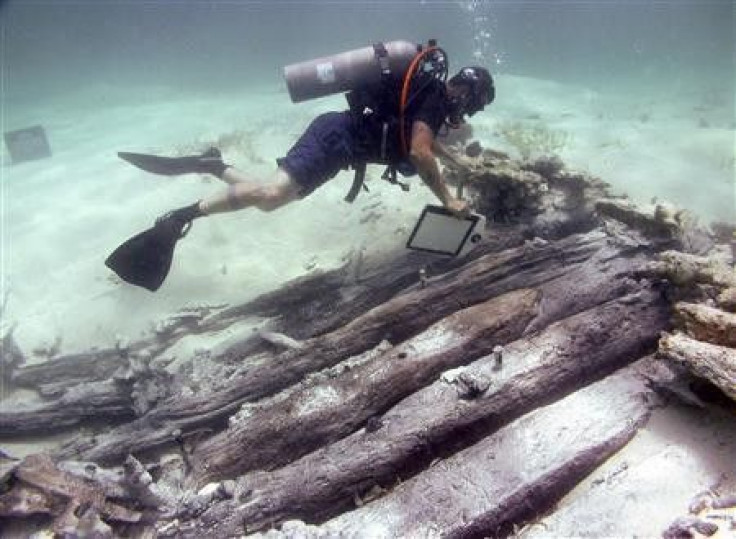 Archaeologist Exploring A Shipwreck