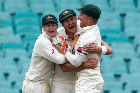Australia&#039;s Shane Watson celebrates with team mates Steven Smith and wicketkeeper Brad Haddin