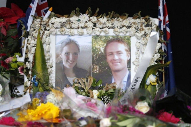 Photographs of Sydney&#039;s cafe siege victims, lawyer Katrina Dawson (L) and cafe manager Tori Johnson are displayed in a floral tribute near the site of the siege in Sydney&#039;s Martin Place, December 23, 2014. A funeral for Johnson and memorial for 
