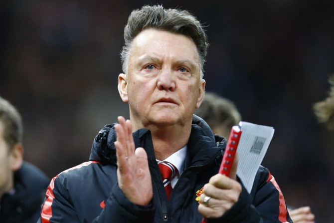 Manchester United&#039;s manager Louis Van Gaal applauds after their English Premier League soccer match against Stoke City at the Britannia Stadium in Stoke-on-Trent, central England January 1, 2015.