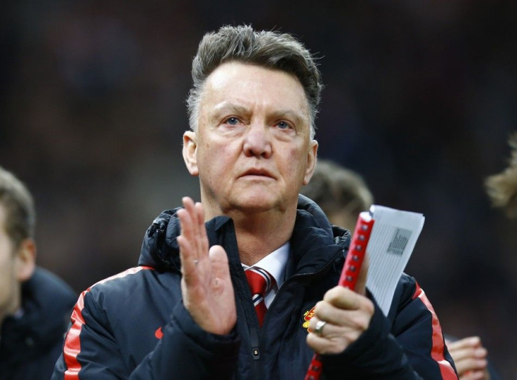 Manchester United&#039;s manager Louis Van Gaal applauds after their English Premier League soccer match against Stoke City at the Britannia Stadium in Stoke-on-Trent, central England January 1, 2015.