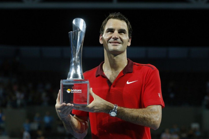 Roger Federer of Switzerland holds the Brisbane Open men&#039;s singles trophy at the Brisbane International tennis tournament in Brisbane, January 11, 2015. Federer defeated Milos Raonic of Canada in three sets to mark his 1,000th career title. REUTERS/J