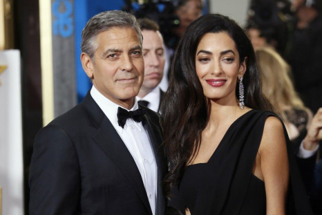 Actor George Clooney and wife, Amal Clooney, arrive at the 72nd Golden Globe Awards in Beverly Hills,