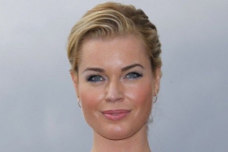 Actress Rebecca Romijn poses during a photocall for the television series "The Librarians" at the annual MIPCOM television programme market in Cannes, October 13, 2014.
