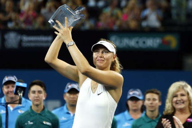 Maria Sharapova of Russia holds the Brisbane International tennis tournament women's singles trophy after defeating Ana Ivanovic of Serbia in Brisbane, January 10, 2015. REUTERS/Jason Reed