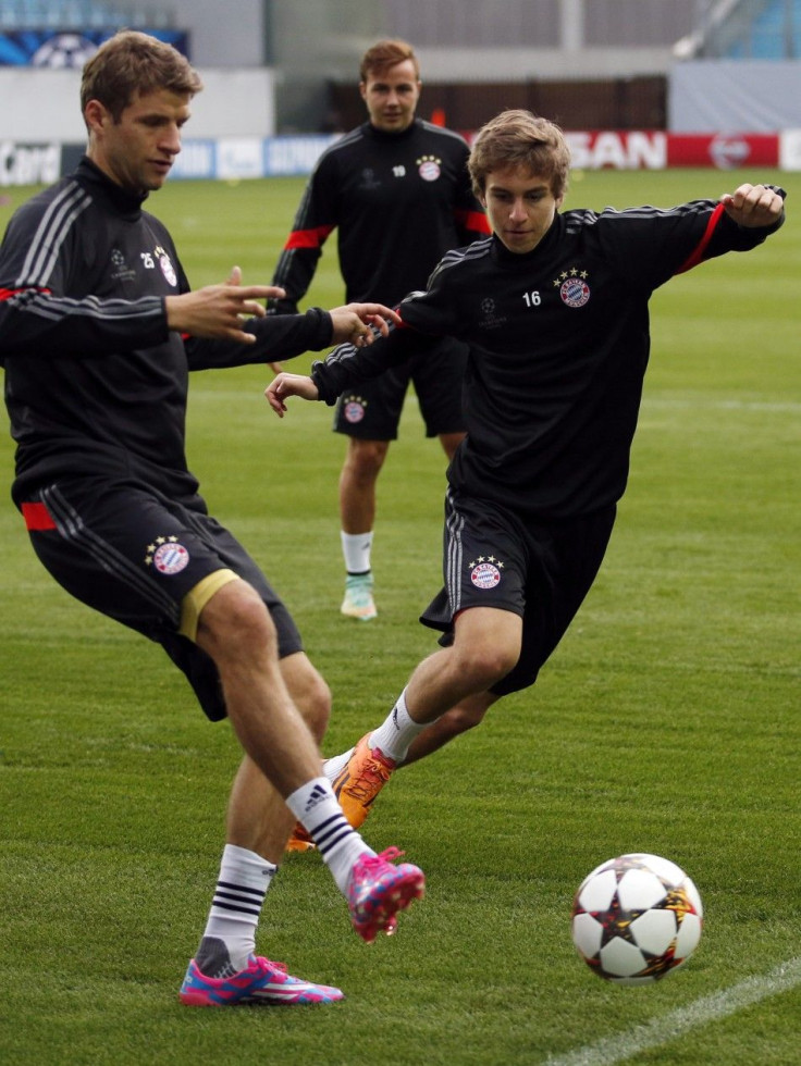 Bayern Munich&#039;s Thomas Muller (L), Mario Gotze (C) and Gianluca Gaudino attend a training session on the eve of their Champions League Group E match against CSKA Moscow at the Arena Khimki outside Moscow, September 29, 2014.