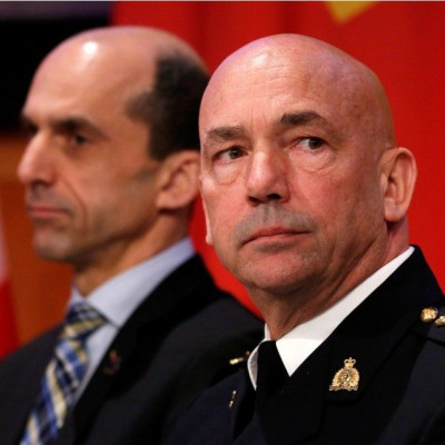 Royal Canadian Mounted Police (RCMP) Commissioner Bob Paulson takes part in a news conference with Canada's Public Safety Minister Steven Blaney in Ottawa
