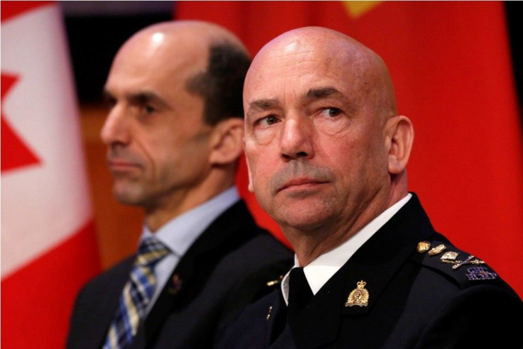 Royal Canadian Mounted Police (RCMP) Commissioner Bob Paulson takes part in a news conference with Canada's Public Safety Minister Steven Blaney in Ottawa
