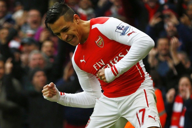 Arsenal&#039;s Alexis Sanchez celebrates after scoring his second goal during their English Premier League soccer match against Stoke City at the Emirates Stadium in London January 11, 2015.