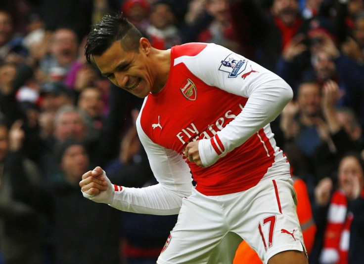 Arsenal&#039;s Alexis Sanchez celebrates after scoring his second goal during their English Premier League soccer match against Stoke City at the Emirates Stadium in London January 11, 2015.