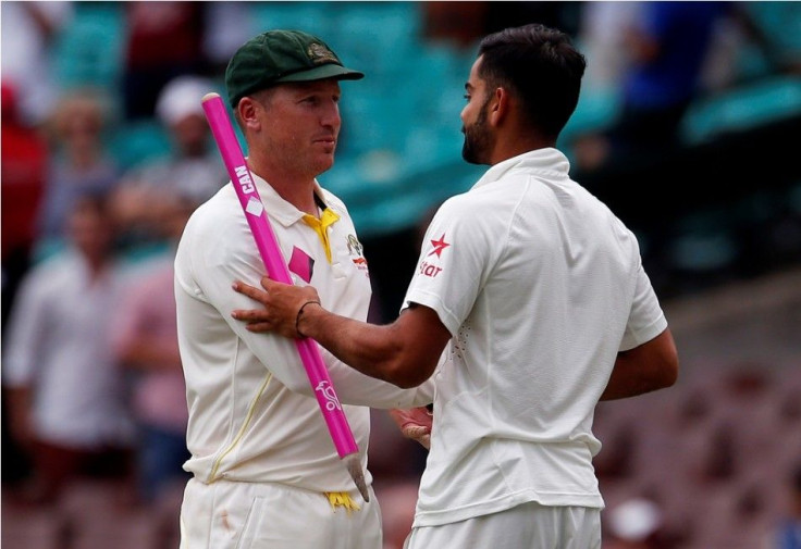 India&#039;s captain Virat Kohli shakes hands with Australia&#039;s wicketkeeper Brad Haddin