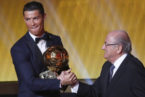 Real Madrid's Cristiano Ronaldo of Portugal, is congratulated by FIFA President Sepp Blatter (R) after winning the FIFA Ballon d'Or 2014 during the soccer awards ceremony at the Kongresshaus in Zurich January 12, 2015. Ronaldo, who won the award