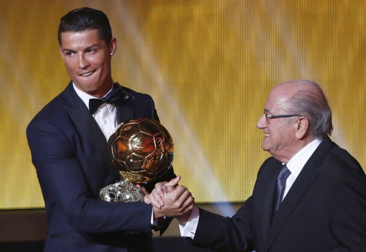 Real Madrid's Cristiano Ronaldo of Portugal, is congratulated by FIFA President Sepp Blatter (R) after winning the FIFA Ballon d'Or 2014 during the soccer awards ceremony at the Kongresshaus in Zurich January 12, 2015. Ronaldo, who won the award