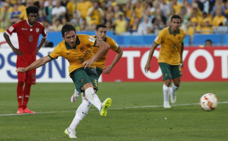 Australia&#039;s Mark Milligan scores a goal from a penalty kick during their Asian Cup Group A soccer match against Oman at the Stadium Australia in Sydney January 13, 2015.