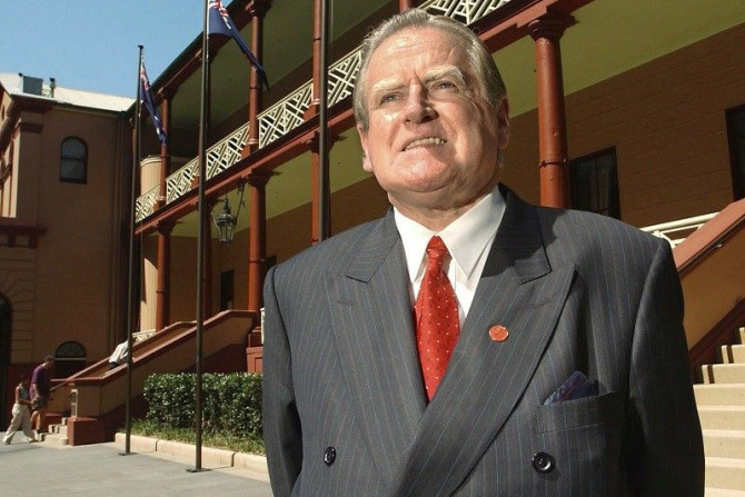 New South Wales legislative council member Reverend Fred Nile stands outside the enterance of the state parliament house in Sydney on November 22, 2002. Nile's call for a ban on Muslim women wearing a traditional head-to-knee gown in public because t