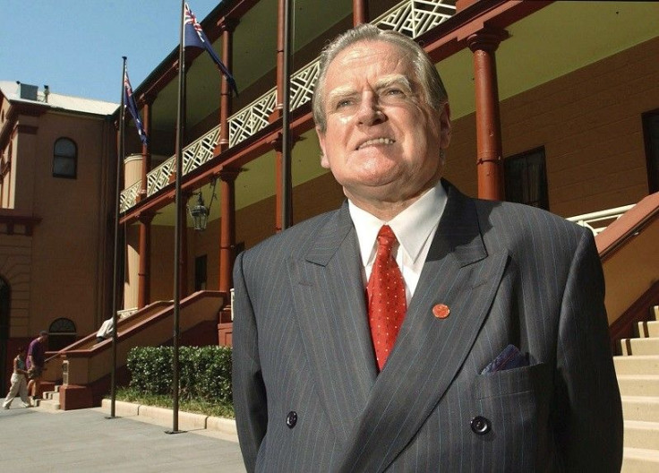 New South Wales legislative council member Reverend Fred Nile stands outside the enterance of the state parliament house in Sydney on November 22, 2002. Nile's call for a ban on Muslim women wearing a traditional head-to-knee gown in public because t