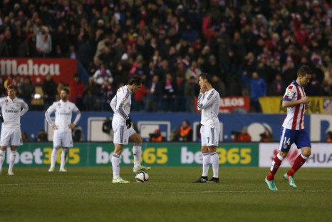 Real Madrid&#039;s Cristiano Ronaldo (2nd R) and Gareth Bale (3rd L) react after Atletico Madrid&#039;s first goal by Raul Garcia during their Spanish King&#039;s Cup soccer match at Vicente Calderon stadium in Madrid, January 7, 2015.