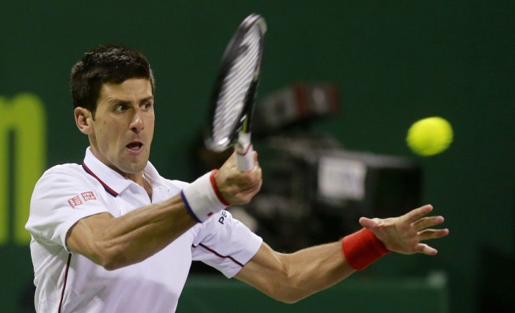 Novak Djokovic of Serbia returns the ball to Croatia&#039;s Ivo Karlovic during their quarterfinal tennis match at the Qatar Open tennis tournament in Doha January 8, 2015.