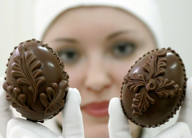 A Belarussian worker displays chocolate Easter eggs at Kommunarka factory in Minsk April 29, 2005. Belarussian Orthodox believers will mark Easter on Sunday.