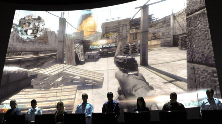 Eighteen gamers demonstrate Electronic Arts' soon to be released Medal of Honor's online multiplayer feature during their press briefing ahead of the Electronic Entertainment Expo (E3) at the Orpheum Theater in Los Angeles, California June 14, 2010. The a