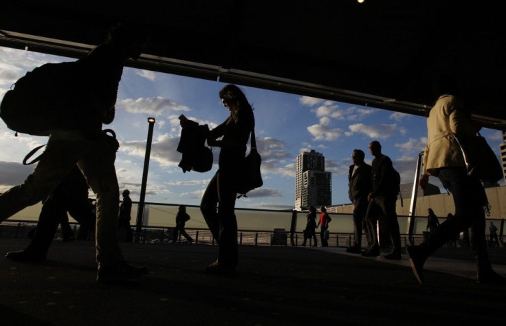 Office workers are seen at Southern Cross train station in Melbourne