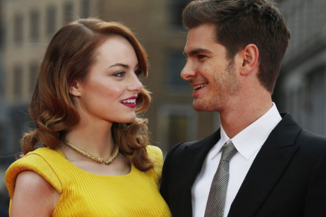 Actors Emma Stone and Andrew Garfield pose for photographs at the world premiere of The Amazing Spiderman 2 in central London, April 10, 2014.