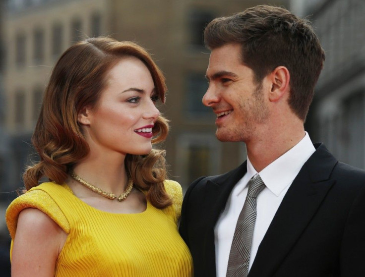 Actors Emma Stone and Andrew Garfield pose for photographs at the world premiere of The Amazing Spiderman 2 in central London, April 10, 2014.