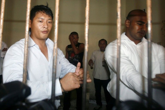 IN PHOTO: Australian Andrew Chan (L) and Myuran Sukumaran wait in a temporary cell for their appeal hearing in Denpasar District Court in Indonesia's resort island of Bali September 21, 2010.