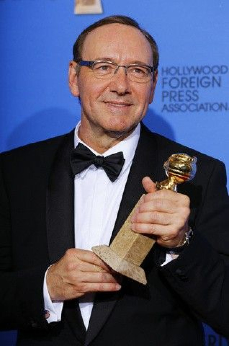 Actor Kevin Spacey poses backstage with his award for Best Performance by an Actor in a Television Series for &quot;House of Cards&quot; during the 72nd Golden Globe Awards